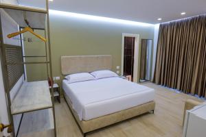 Ένα ή περισσότερα κρεβάτια σε δωμάτιο στο Vila Marjana