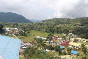 a small town with auliculiculiculiculiculiculiculiculiculiculic at Family Guest House Moni in Kelimutu +54 photos