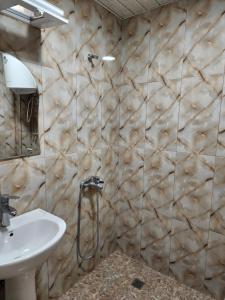 a bathroom with a sink and a mirror at Black Sea House Georgia in Shekhvetili