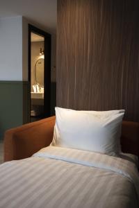 Postel nebo postele na pokoji v ubytování Monocolo Boutique Hotel