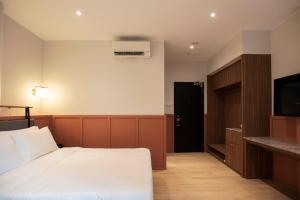 Postel nebo postele na pokoji v ubytování Monocolo Boutique Hotel