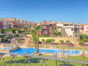 a view of a swimming pool at a resort at Magnífico-amplio Dúplex 2 plantas piscina Altaona in Murcia