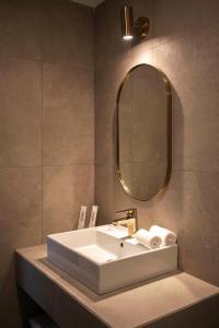 Koupelna v ubytování Monocolo Boutique Hotel