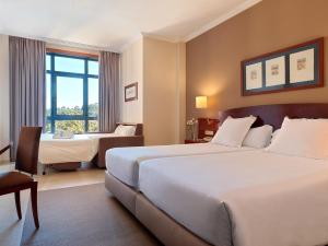 Кровать или кровати в номере Hotel Spa Galatea