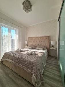 a bedroom with a large bed and a large window at Villa M&M in Sevid +109 photos