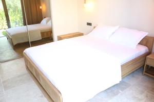 Postel nebo postele na pokoji v ubytování Life Butiq Otel