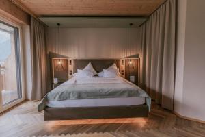 Łóżko lub łóżka w pokoju w obiekcie G'sund & Natur Hotel Die Wasnerin - Adults Only