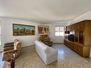 a living room with a couch and a table at BIGGER FLAT IDEAL PARA FAMILIA NEAR CENTER AND BEACH in Valencia