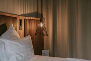 Łóżko lub łóżka w pokoju w obiekcie G'sund & Natur Hotel Die Wasnerin - Adults Only