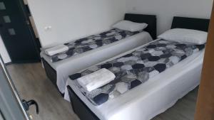 Postel nebo postele na pokoji v ubytování ALB NEGRU
