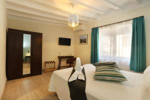 Postel nebo postele na pokoji v ubytování Nasilvana Hotel & Spa Adults Only