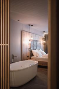 A bed or beds in a room at AhriaPura