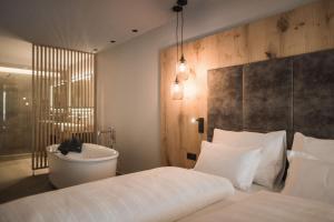 A bed or beds in a room at AhriaPura