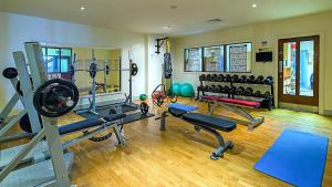a gym with a lot of exercise equipment in it at Mulranny Park Hotel in Mulranny