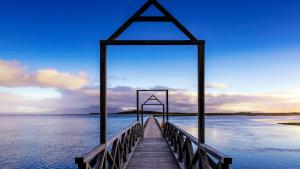 a wooden pier sticking out into the water at Mulranny Park Hotel in Mulranny