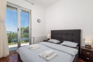 Postel nebo postele na pokoji v ubytování Stella Premium Apartment Opatija