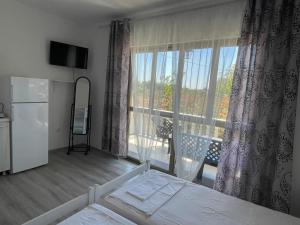 Postel nebo postele na pokoji v ubytování White apartments