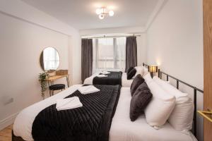 Katil atau katil-katil dalam bilik di Blueberries Apartments by Sasco