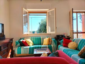 A television and/or entertainment centre at La Casa di Ludovica Még 10 kép