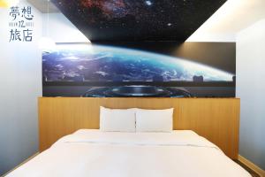 A bed or beds in a room at Dream 12 Hotel