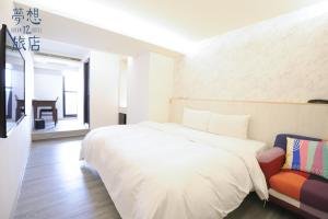 A bed or beds in a room at Dream 12 Hotel