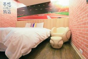 A bed or beds in a room at Dream 12 Hotel