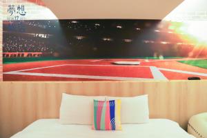 A bed or beds in a room at Dream 12 Hotel