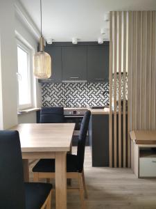 Posedenie v ubytovaní Apartament ZDRÓJ + 8 fotografií