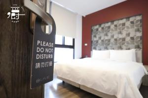 Postel nebo postele na pokoji v ubytování Aroma Chew Hotel