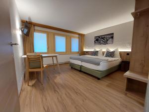 Postel nebo postele na pokoji v ubytování Modernes Studio Zermatt