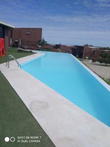 Der Swimmingpool an oder in der Nähe von Condomínio Veloso