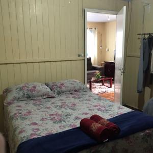 מיטה או מיטות בחדר ב-RECANTO DA VÓ NINIDA