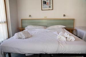 Letto o letti in una camera di Residence Nube D'Argento