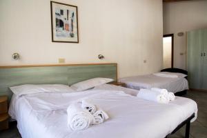 Letto o letti in una camera di Residence Nube D'Argento