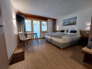 Postel nebo postele na pokoji v ubytování Modernes Studio Zermatt