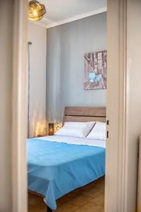 Ένα ή περισσότερα κρεβάτια σε δωμάτιο στο Casa Dapergola