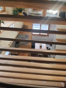 an overhead view of a wooden bench in a room at Domaine Pinsol in Uchacq-et-Parentis