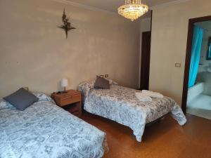 Postel nebo postele na pokoji v ubytování QUINTA ANDAINA