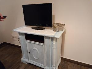 a tv sitting on top of a table with a television at DormireInCentro in Ancona