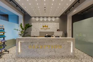 a lobby of a store with a reception desk at Hotel Monarch in Batumi