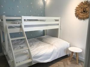 Tempat tidur susun dalam kamar di La p’tite Hoguette
