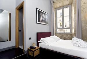 Ένα ή περισσότερα κρεβάτια σε δωμάτιο στο Suite Art Navona