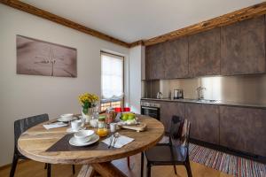 a kitchen with a wooden table in a room at Chalet Ines in Vodo Cadore