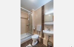 Kúpeľňa v ubytovaní Sinus Prémium Aparthotel Siófok