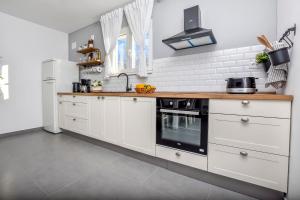 Kuchyňa alebo kuchynka v ubytovaní Apartment Bo&Dy