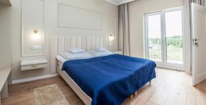 Postel nebo postele na pokoji v ubytování Jaśminowe Wzgórze Apartamenty blisko plaży