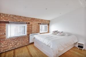 Posteľ alebo postele v izbe v ubytovaní Le Cosy Spa & Office au cœur de Toulouse