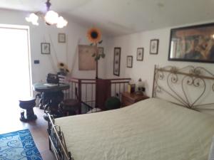 Postel nebo postele na pokoji v ubytování B&B Ameglia