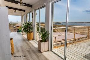 a house with a balcony with a view of the ocean at La Balsa in José Ignacio