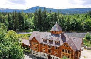 an aerial view of a large building with a tower at Trevilles Art-Deco Józefina in Szklarska Poręba